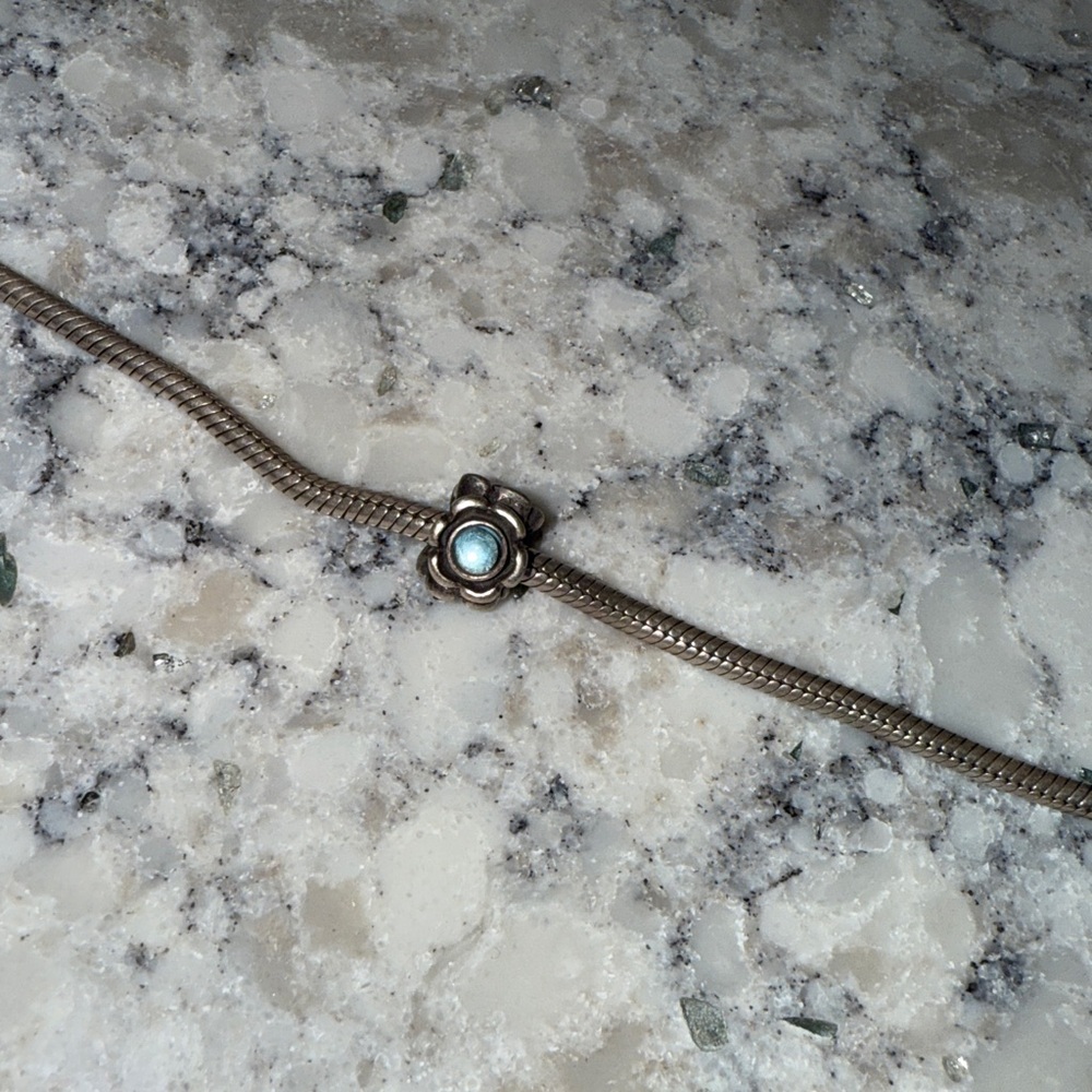 Flower Pandora bead with blue stone
